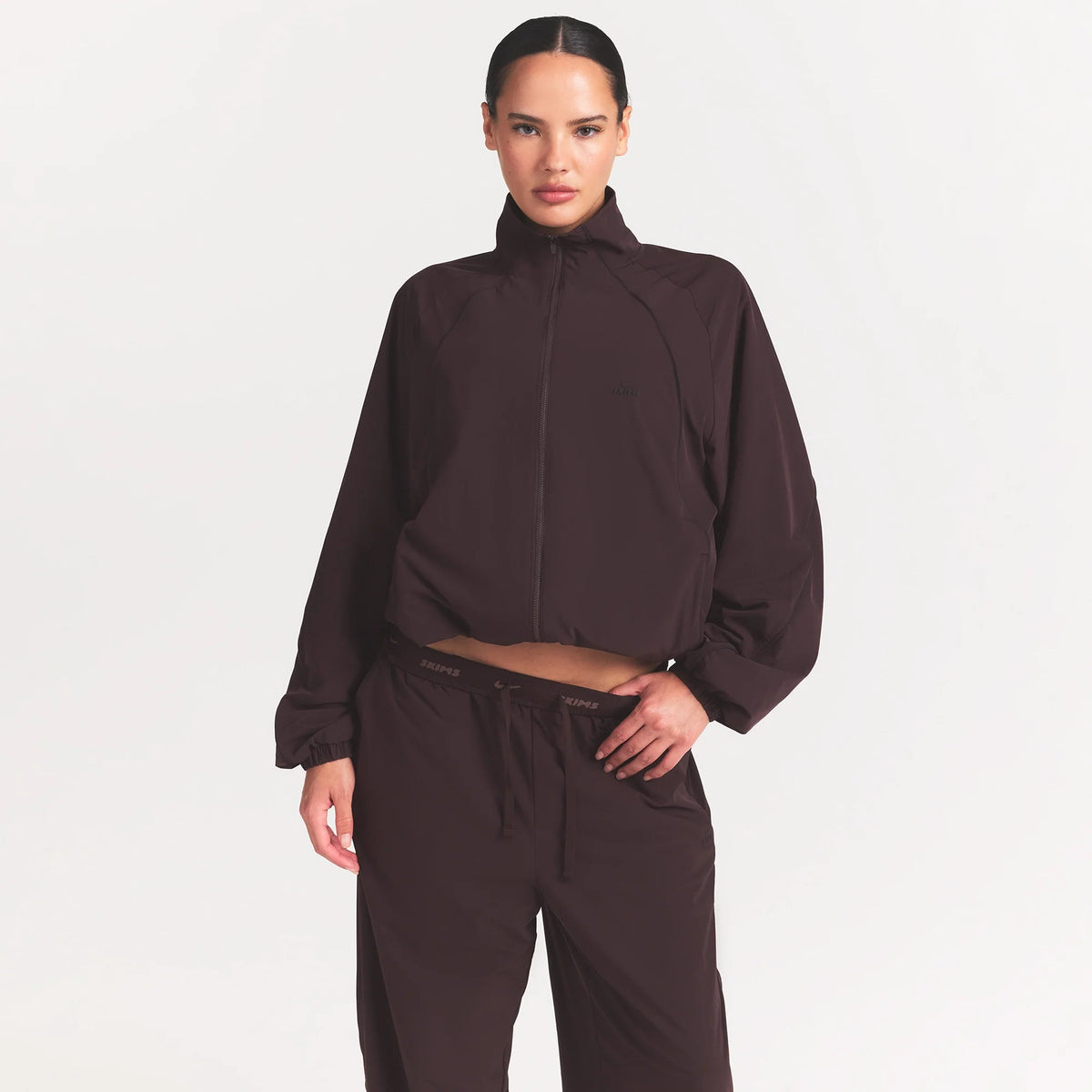 NikeSKIMS STRETCH NYLON OVERSIZED TRACK JACKET | DARK ROAST