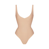 SKIMS BODY UNLINED PLUNGE THONG BODYSUIT | CLAY