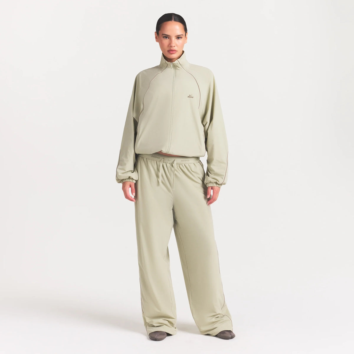 NikeSKIMS STRETCH NYLON OVERSIZED TRACK JACKET | TALC