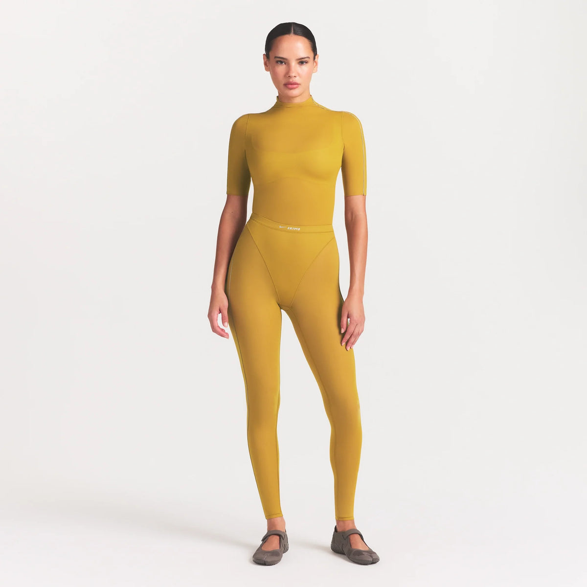 NikeSKIMS WEIGHTLESS LAYERS MOCK NECK SHORT SLEEVE T-SHIRT | CITRINE
